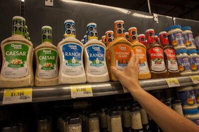 A supermarket shelf in Santiago. Each of the black nutrition labels indicates a product is high in one of four categories: salt, sugar, calories and fat.