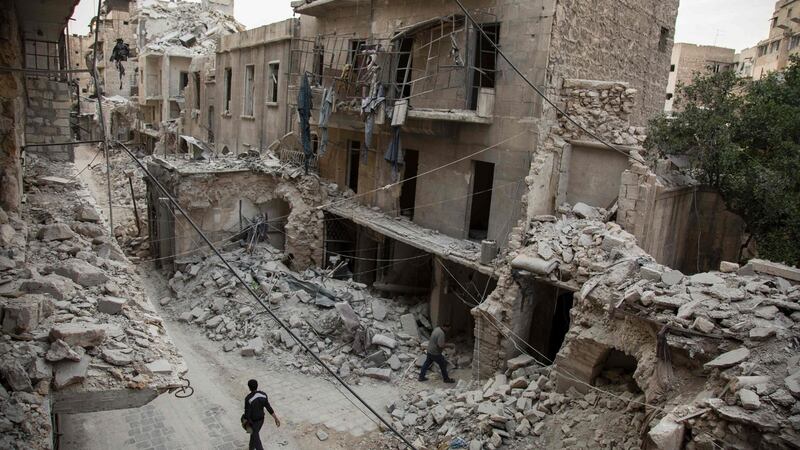 May 2nd: A Syrian man walks past destroyed buildings on in Aleppo’s Bab al-Hadid neighbourhood which was targeted recently by regime air strikes. Photograph: Karam al-Masri/AFP/Getty Images