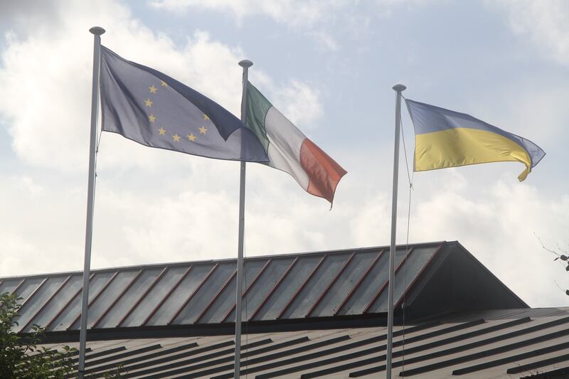 EU, Irish and Ukrainian flags fly above St Peter's College in Dunboyne. Photograph: Ronan McGreevy