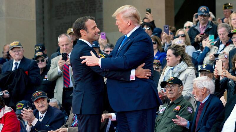 French president Emmanuel Macron and US president Donald Trump embrace at the Normandy American Cemetery in Colleville-sur-Mer on Thursday. Photograph: Doug Mills/New York Times
