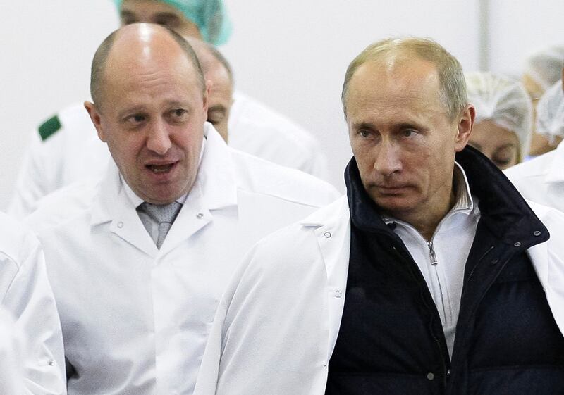 Yevgeny Prigozhin and Vladimir Putin at the opening of a factory to produce school meals in 2010, outside St Petersburg. Photograph: Alexei Druzhinin/Kremlin via AP