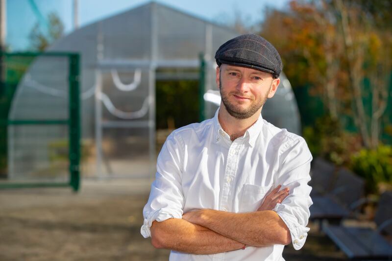 Patrick Kirwan, science teacher at Ardscoil na Mara, Tramore, Co Waterford  in front of the new greenhouse  at the school. Photograph: Patrick Browne