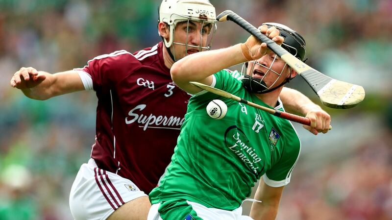 Galway’s Daithi Burke and Peter Casey of Limerick. Photograph: James Crombie/Inpho
