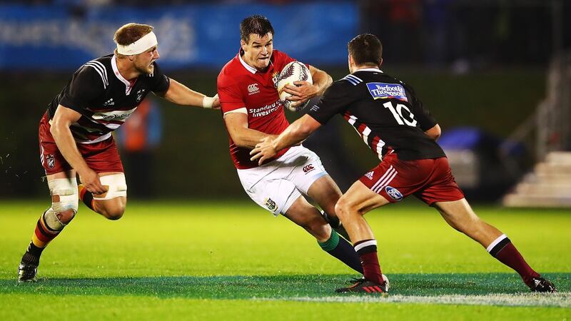 Johnny Sexton tries to makes a break during the match against the Barbarians. Photograph: Hannah Peters/Getty Images