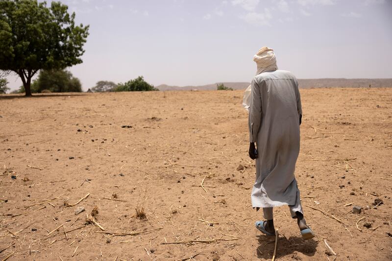 A local chief walks to the barren village of Sira in Chad. Photograph: Chris Maddaloni/The Irish Times