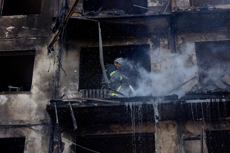 A firefighter works to extinguish a fire in a damaged residential building following a strike in Dobropillia, Donetsk. Photograph: Getty Images