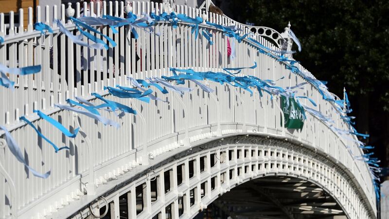 Blue ribbons are tied to Ha’Penny Bridge in  Dublin to remember the victims of clerical sex abuse ahead. Photograph: PA Wire