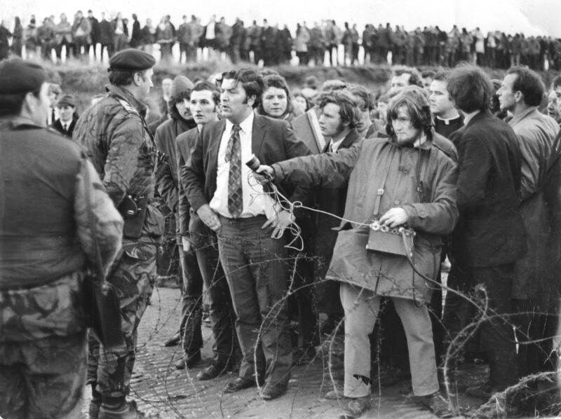 Magilligan Anti-Internment Rally, Derry 1972. Mr John Hume who participated in the rally,  speaking to a British army soldier.  Photograph: Jimmy McCormack / The Irish Times