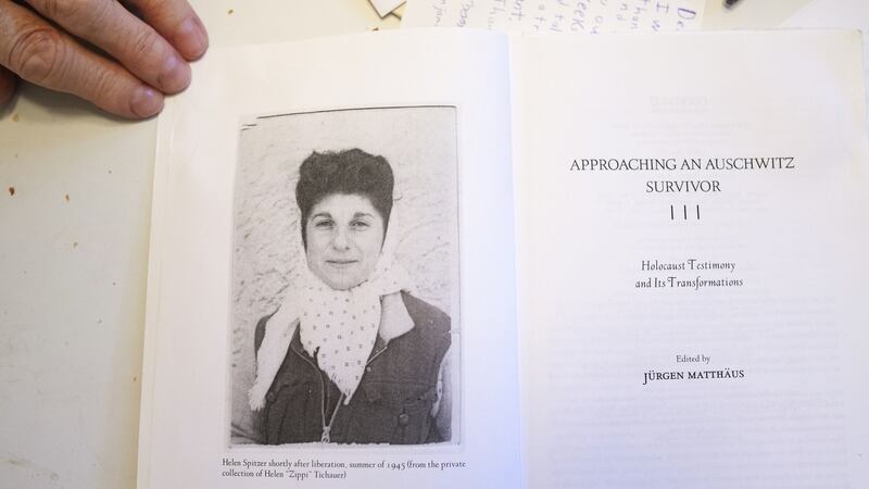 David Wisnia, an Auschwitz survivor, holds a copy of the book devoted to interviews with fellow Auschwitz survivor and former lover, Helen Spitzer, the woman he knew as Zippi, at his home in Levittown, US in November 2019.  Photograph: Danna Singer/The New York Times