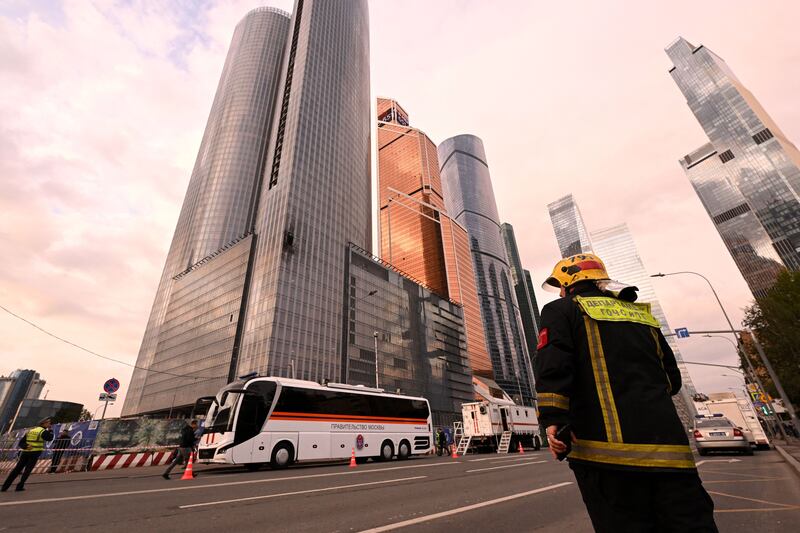 A fireman stands near a damaged building of the Moscow International Business Center (Moskva City) following a drone attack in Moscow on August 23rd, 2023. Photograph: NATALIA KOLESNIKOVA/AFP via Getty Images