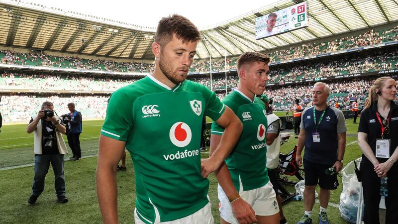Ross Byrne and Garry Ringrose leave the pitch after Ireland’s defeat to England. Photograph: Billy Stickland/Inpho