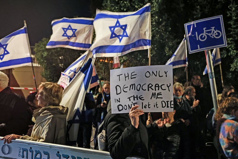 Protesters gather with Israeli national flags against the against judicial reform. Photograph: Ahmad Gharabali/AFP/Getty Images