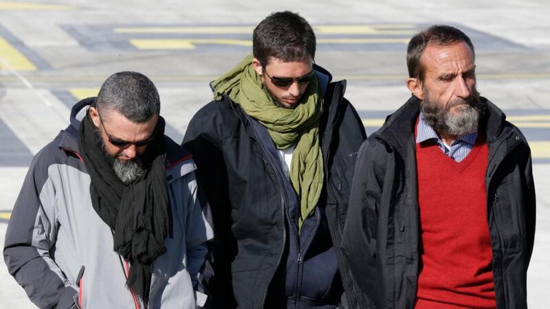 Freed French hostages (from left) Marc Feret, Pierre Legrand and Daniel Larribe after their arrival at Villacoublay military airport near Paris on Wednesday. Photograph: Reuters/Jacky Naegelen