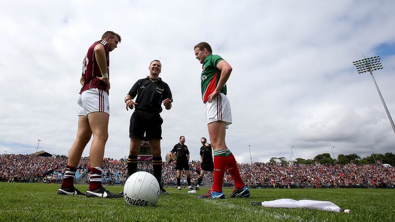 Galway’s Gary O’Donnell and Mayo’s Andy Moran line up with referee Rory Hickey prior to the Connacht SFC final of 2014 at  MacHale Park, Castlebar. Photograph: Donall Farmer/Inpho
