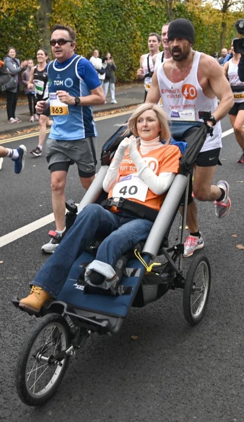 Actor Colin Farrell with Emma Fogarty during the Dublin Marathon. Photograph: Louise Walsh