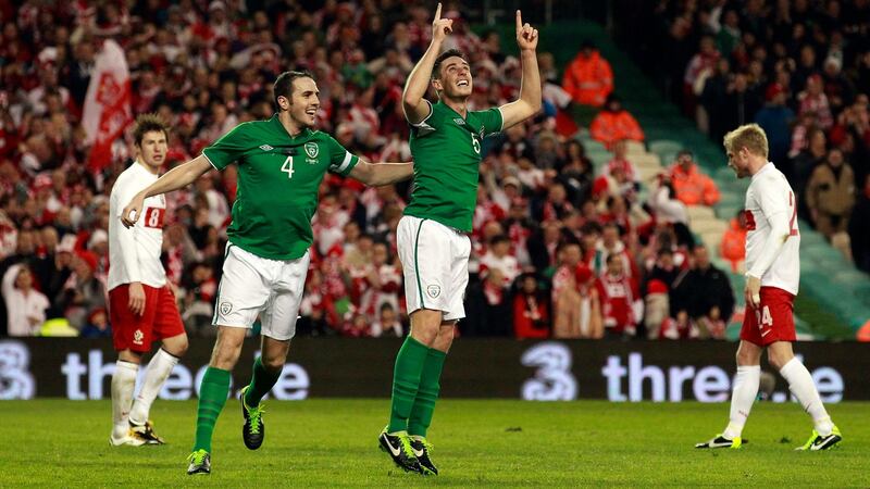 Ireland’s Ciaran Clark is congratulated by team-mate John O’Shea after scoring against Poland at the  Aviva Stadium. Photograph: Cathal McNaughton/Reuters