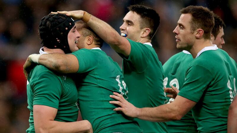 Tommy O’Donnell celebrates his try with teammates.