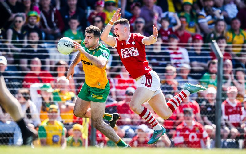 Donegal's Caolan McGonagle and Conor Corbett of Cork. Photograph: Nick Elliott/Inpho