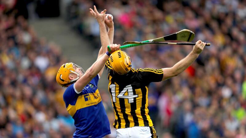 Tipperary’s Ronan Maher claims possession ahead of Kilkenny’s  Colin Fennelly during the All-Ireland hurling final at Croke Park. Photograph: Oisín Keniry/Inpho