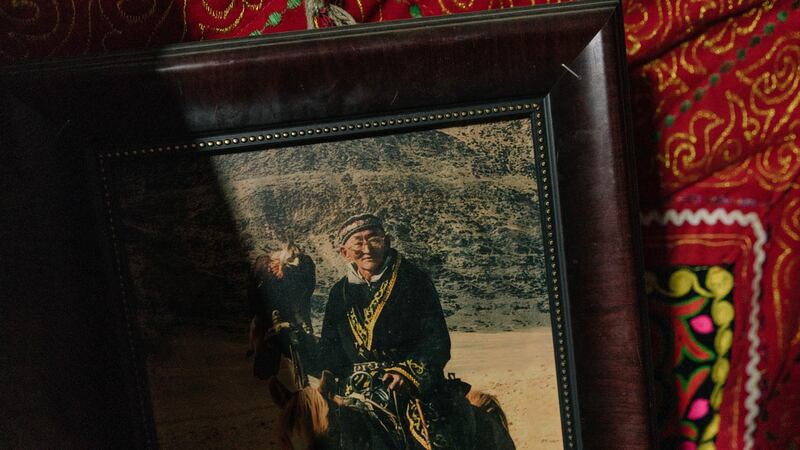 A photograph of eagle hunter Talap Zamanbol’s late grandfather, Matei, is seen in her home in Bayan Ulgii, Mongolia. Photograph: Hannah Reyes Morales/The New York Times