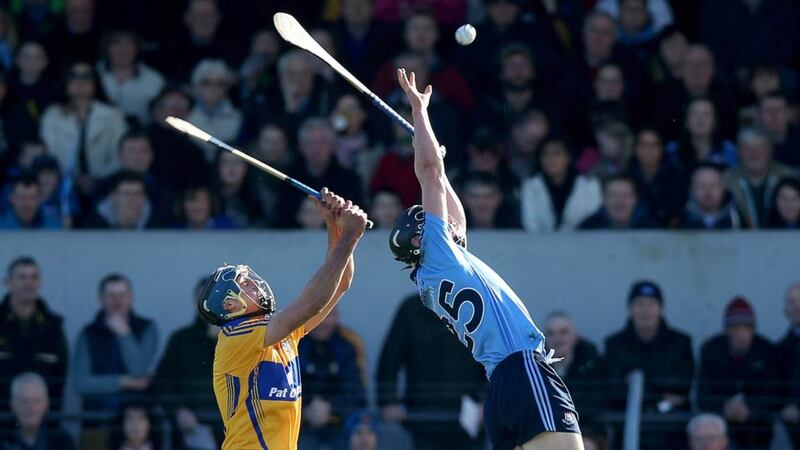 Dublin’s Mark Schutte is challenged by Brendan Bugler of Clare. Photograph: Donall Farmer/Inpho