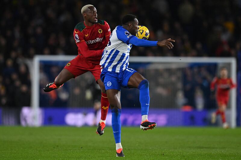 Wolverhampton Wanderers' Tote Gomes vies with Brighton's Danny Welbeck. Photograph: Glyn Kirk/AFP via Getty
