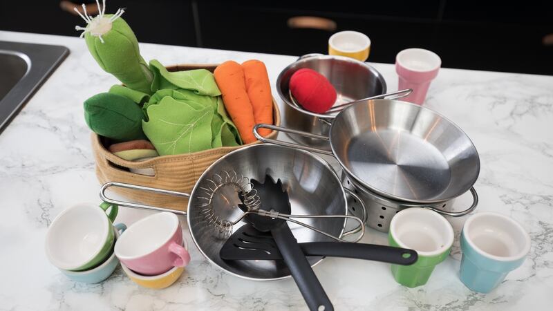 The miniature pots and pans that her child cooks with.