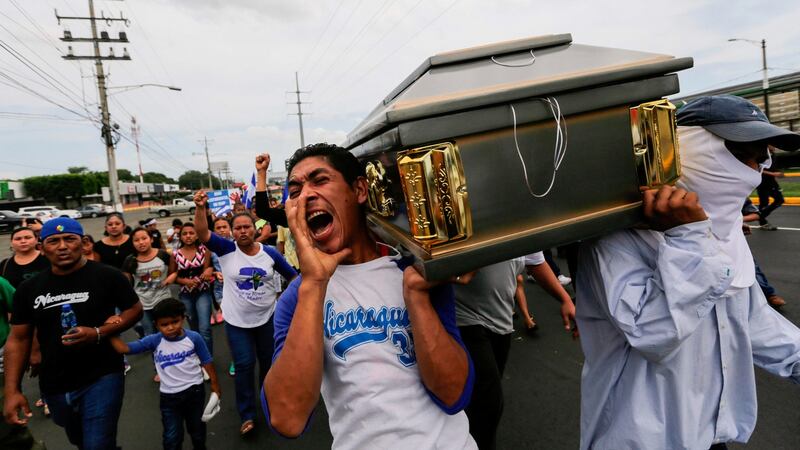 Friends and relatives carry the coffin at the funeral on Monday of   Gerald Velazquez, a student shot dead during clashes with riot police in  Managua. Photograph: Inti Ocon/AFP/Getty Images
