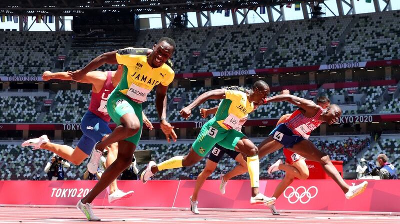 Hansle Parchment finishes first ahead of Grant Holloway and Ronald Levy to win the gold medal in the men’s 110m hurdles final at the Olympic Stadium. Photograph: Matthias Hangst/Getty Images