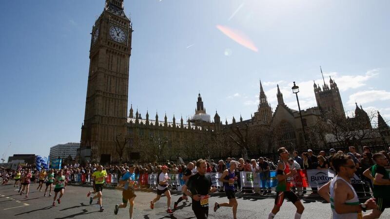 Runners pass the Houses of Parliament during the  London Marathon. Photograph: Harry Engels/Getty Images