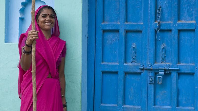A Gulabi Gang member from the village of Rauli Kayanpur dressed in her pink sari uniform. Photograph: Carol Ryan