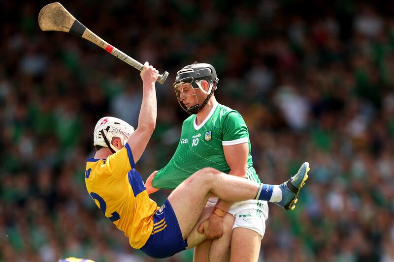 Tempers flare between Limerick's Gearoid Hegarty and Adam Hogan of Clare at the TUS Gaelic Grounds in Limerick. Photograph: Laszlo Geczo/Inpho