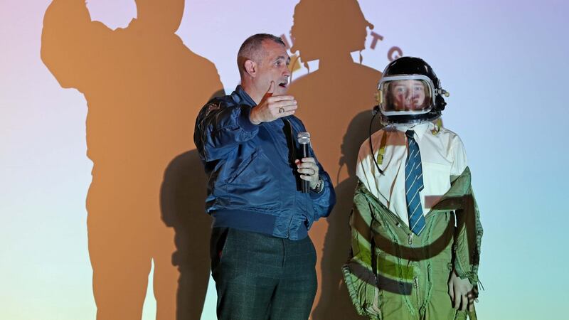 Rory Fitzpatrick, chief executive of the National Space Centre Ltd, explaining to students how lean astronaut’s need to be to travel in space, as demonstrated by the Jump Suit not fitting a second year student in Glanmire Community College. Photograph: Jim Coughlan.
