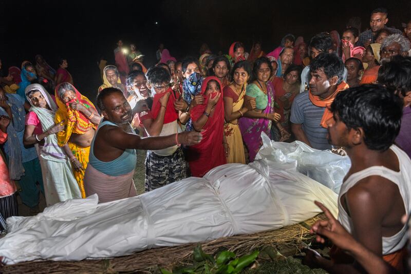 Mourners at the funeral of Rakesh Kumar Yadav in Dhamaura, Nepal, on April 13th, 2022. Yadav, a 40-year-old Nepali, died three months after arriving in Dubai to work as a security guard. Photograph: Saumya Khandelwal/New York Times