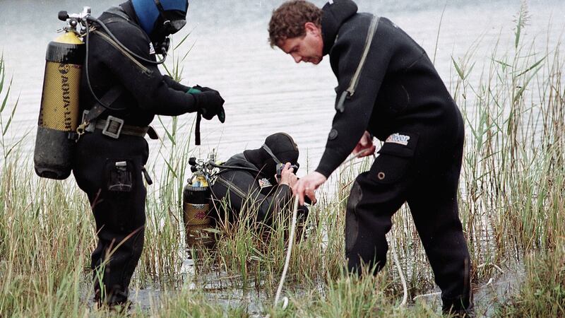 A diving team at a local lake in 1999 amid one of many searches for Mary Boyle, who vanished from her grandparents’ home at Cashelard, outside Ballyshannon, Donegal, in 1977. File photograph: Trevor McBride