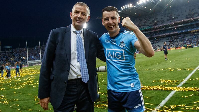 Dublin county board chief executive John Costello celebrates All-Ireland victory with his son Cormac. Photograph: James Crombie/Inpho