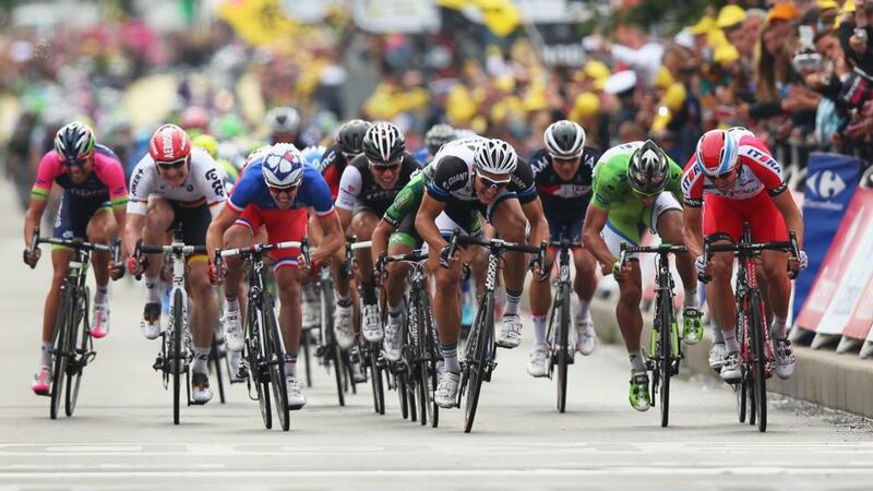 Marcel Kittel of Germany and Team Giant-Shimano (centre) shows the strain during the  sprint finish on his way to winning the fourth stage of the Tour de France in Lille, his third stage win so far in this year’s race. Photograph:   Bryn Lennon/Getty Images