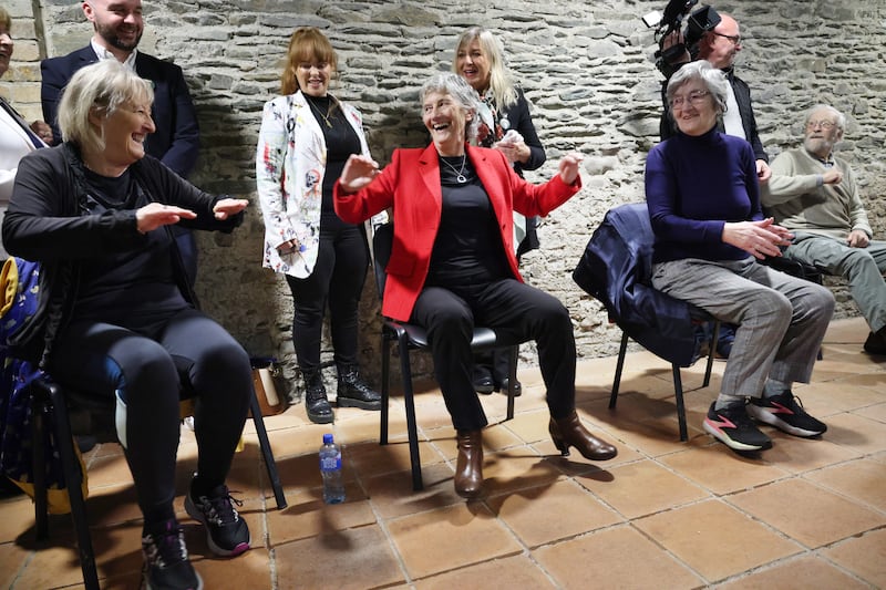Catherine Connolly tries her hand at chair exercise during a class while visiting the McAuley Place centre in Naas, Co Kildare while canvassing on Tuesday. Photograph: Bryan O’Brien/The Irish Times