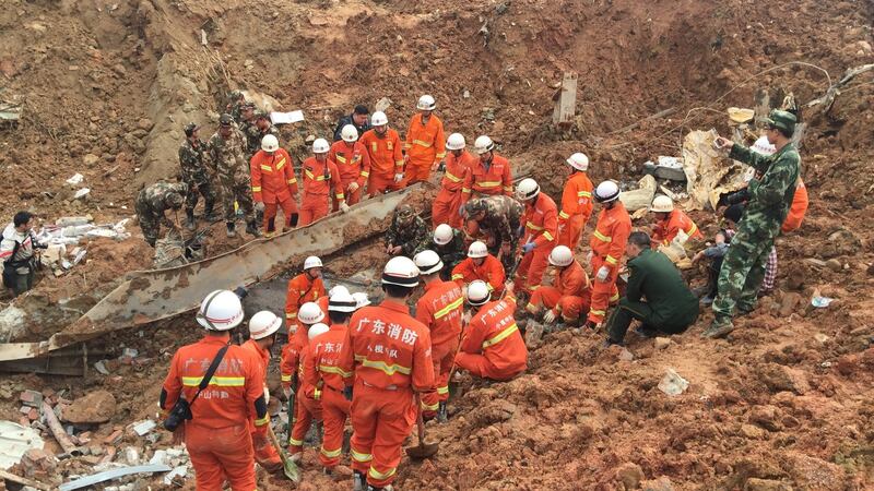 Rescue workers search for survivors in Shenzhen, China after a landslide in a business park buried 33 buildings and left at least 91 people missing. Photograph: Reuters.