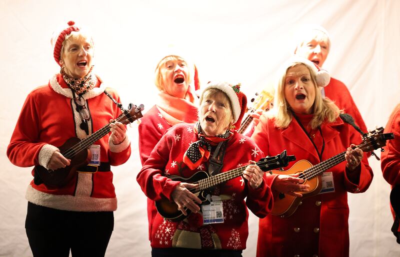 Members of Rathfarnham Ukulele Group at Leinster Lawn on Tuesday evening. Photograph: Dara Mac Dónaill







