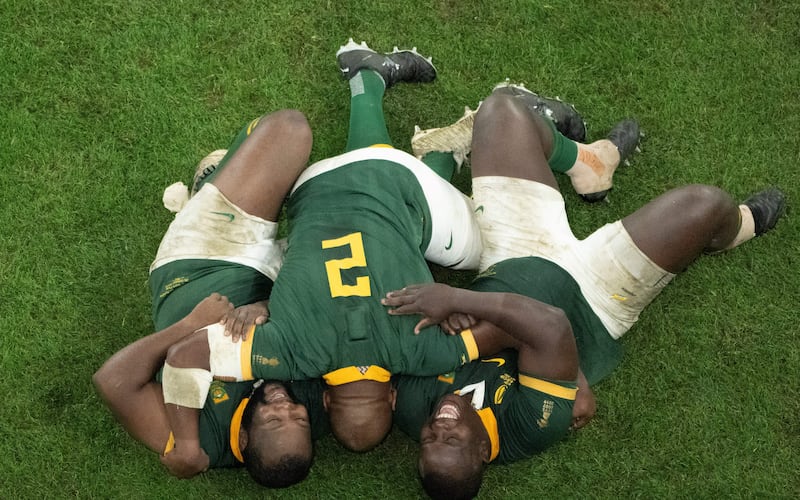 South Africa's hooker Bongi Mbonambi (centre) celebrates with team-mates Ox Nche (left) and Trevor Nyakane after victory in the Rugby World Cup final. Photograph: Antonin Thullier/AFP via Getty Images