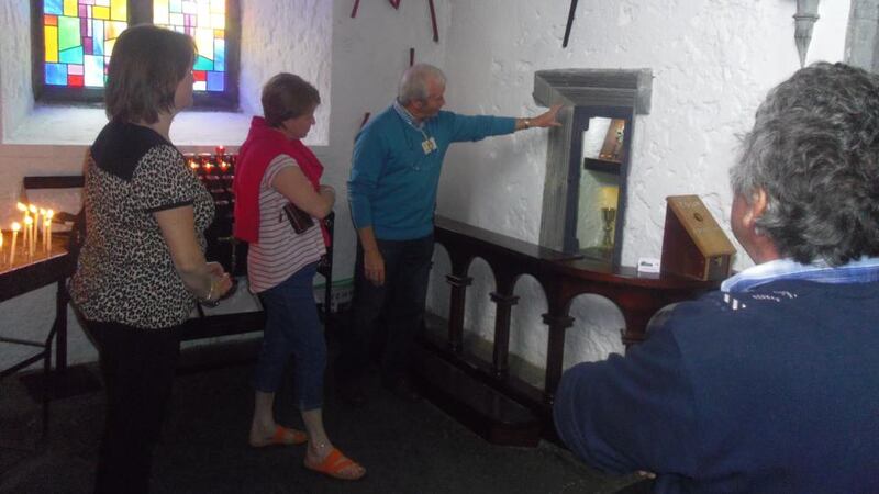 Holy Cross: Tom Gallagher takes a tour group about the buildings