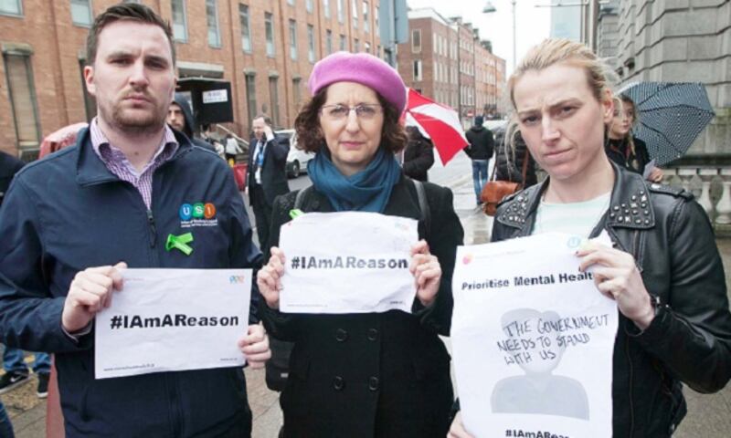 Kevin Donoghue president of the Union of Students in Ireland, Shari McDaid director of Mental Health Reform, Lynn Ruane newly-elected Independent Senator during a protest against the mental health budget diversion of €12 million outside Leinster House, Dublin. Photograph: Gareth Chaney/Collins
