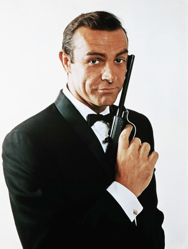 Portrait of Sean Connery, as James Bond, caressing the barrel of a gun against the side of his face. Photograph: Bettmann/CORBIS