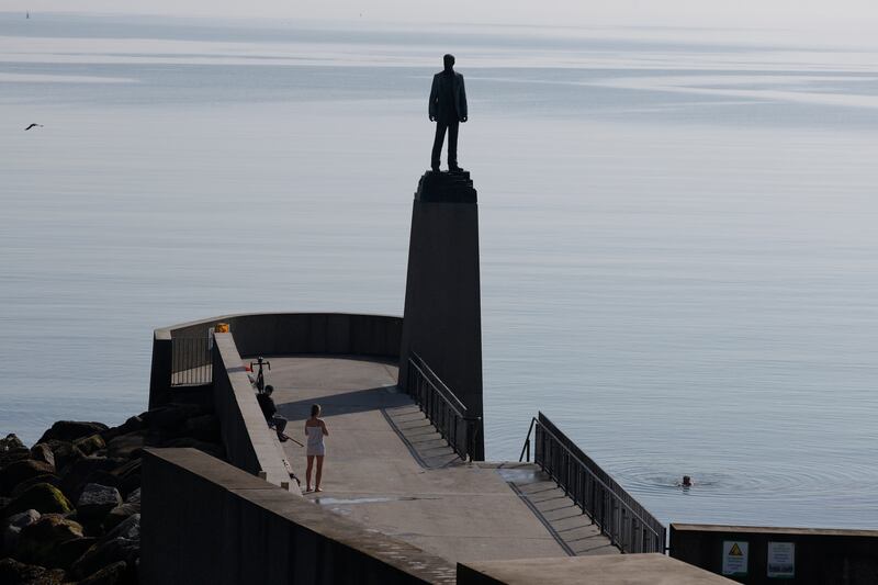 A swimmer at the Casement statue, Dun Laoghaire on Wednesday. Photograph Nick Bradshaw