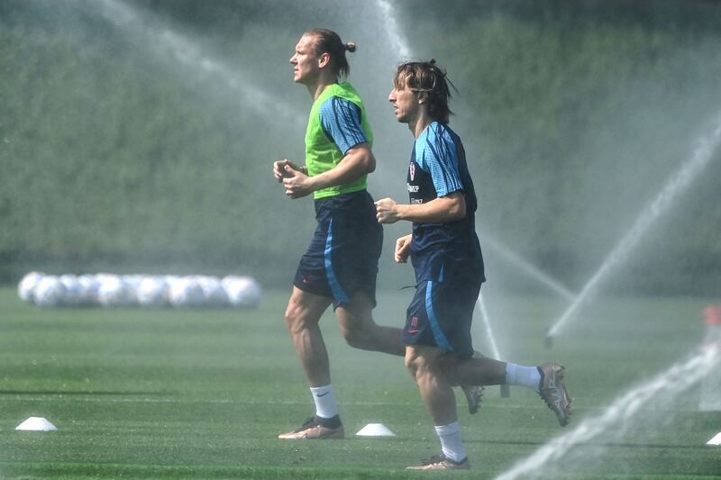 Croatia's midfielder Luka Modric (right) and  defender Domagoj Vida run in the heat during a training session at the 2022 World cup in Qatar. Photograph: Ozan Kose/AFP via Getty Images