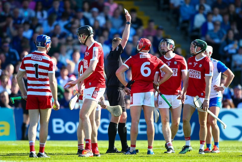 Michael Kennedy shows Cork’s Ciaran Joyce a black card. Photograph: Ken Sutton/Inpho