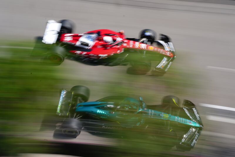 Ferrari's Charles Leclerc and Aston Martin's Lance Stroll during the race. Photograph: David Davies/PA