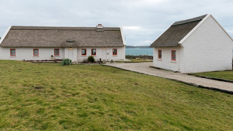 Tir na nOg, Connemara: the large, thatched cottage right on the sea in Connemara comes with a sauna and sleeps nine. Prices start from €4,750 a week