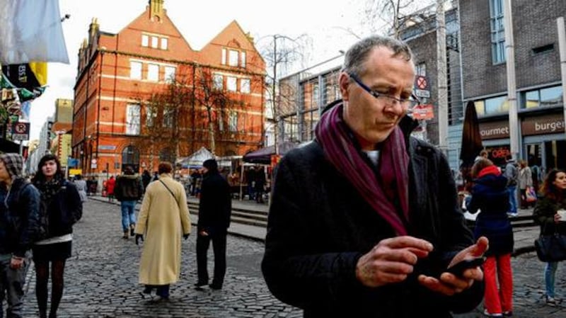 Kevin Courtney looking for wifi in Temple Bar Square